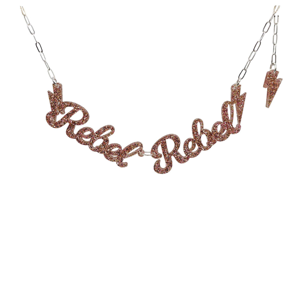 Rebel Rebel Necklace in pink fizz glitter shown hanging against a white background. 