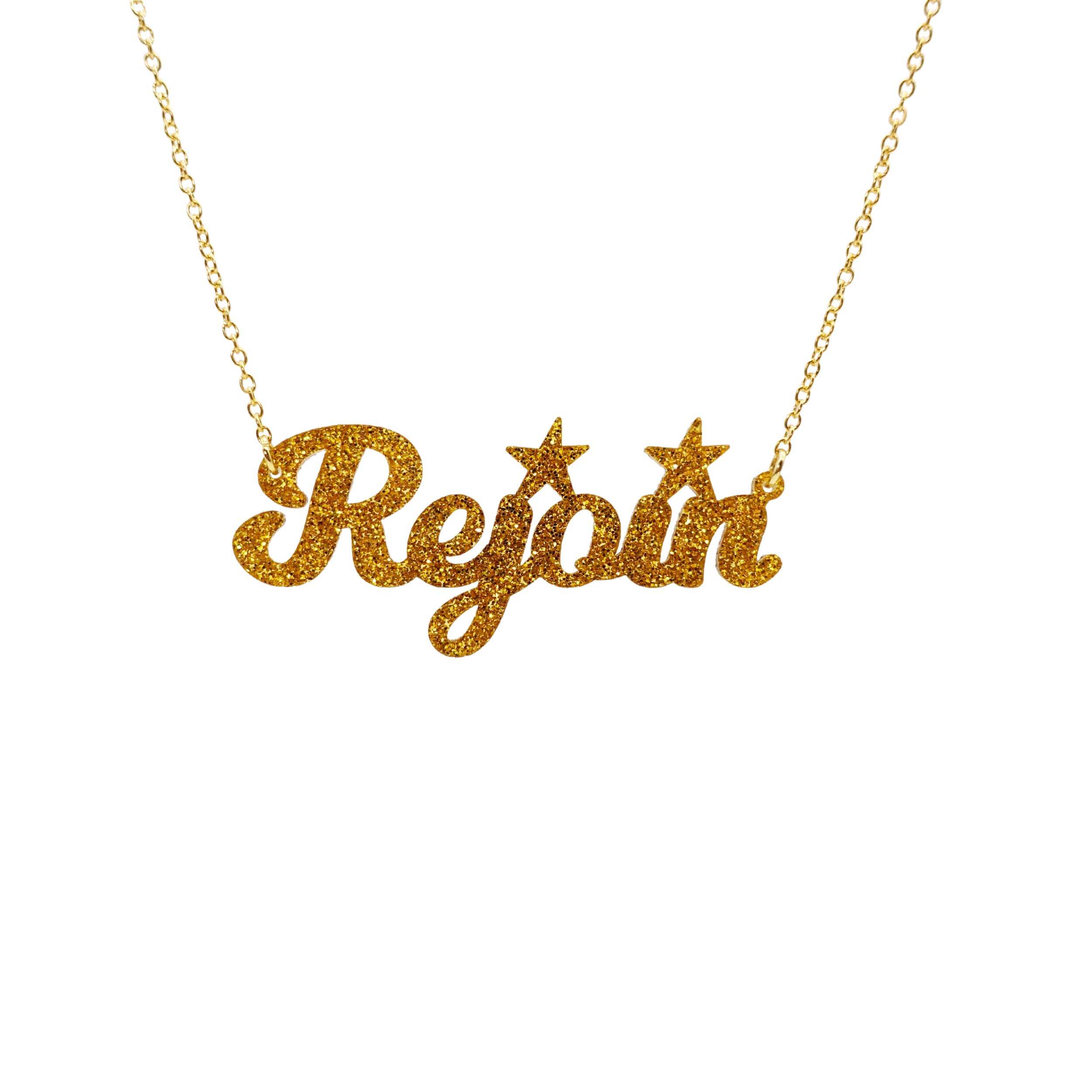 Rejoin the EU necklace in ultra gold glitter, shown hanging against a white background. 