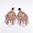 Western style Resist and Persist statement dangly earrings in rose gold.