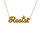 Resist necklace in ultra gold glitter, shown hanging against a white background. 