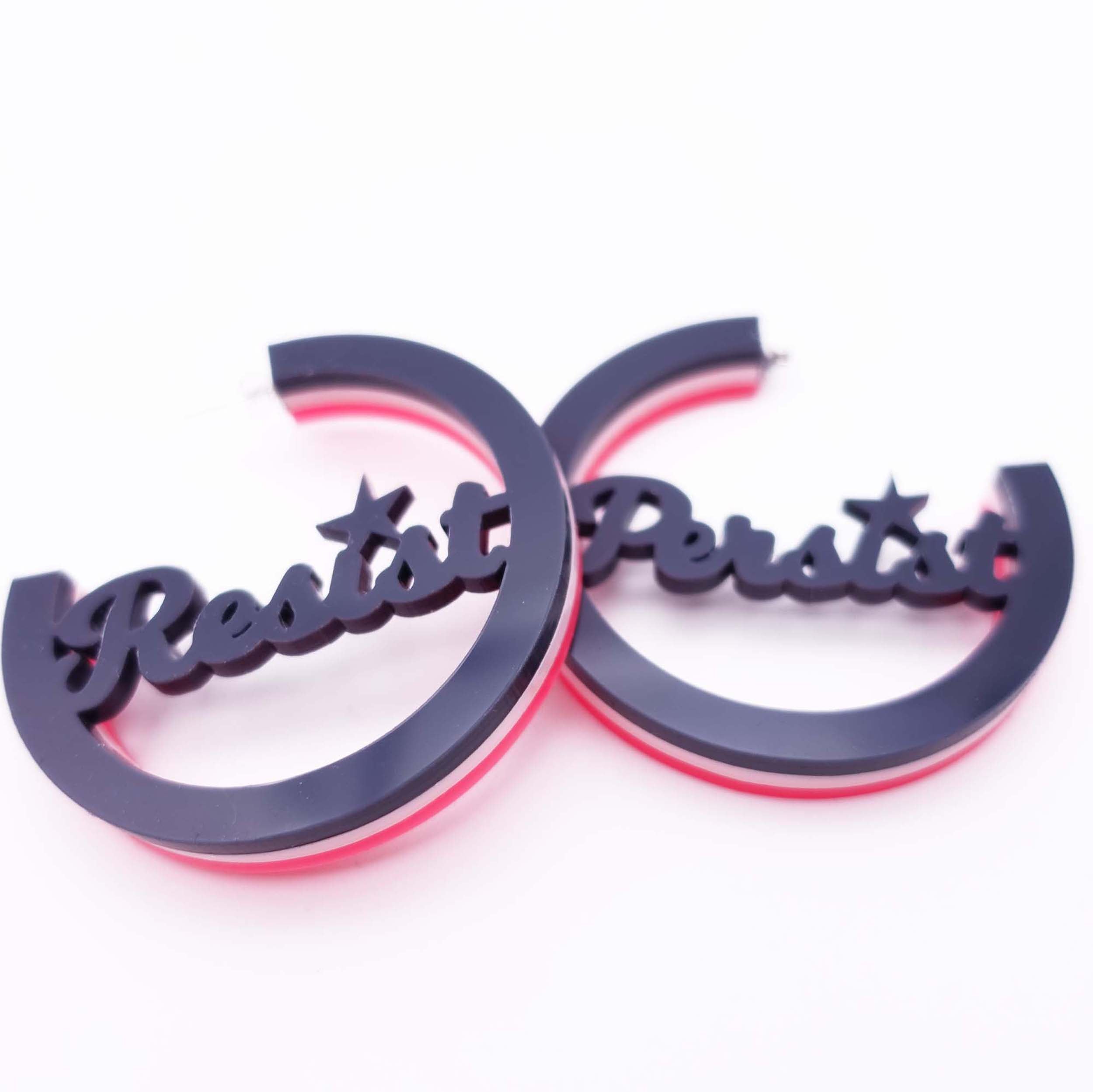Resist and Persist statement hoops in Record Collection: Slate, baby pink and hot pink. 