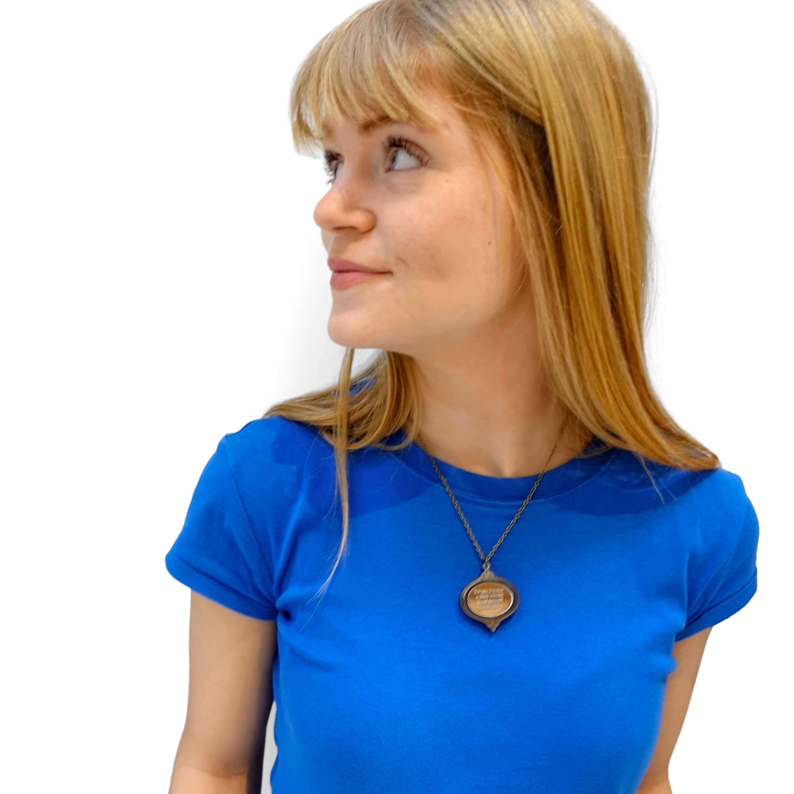 Eliza wears the 'I wish I were a girl again' Wuthering Heights necklace from the Bronte Collection.