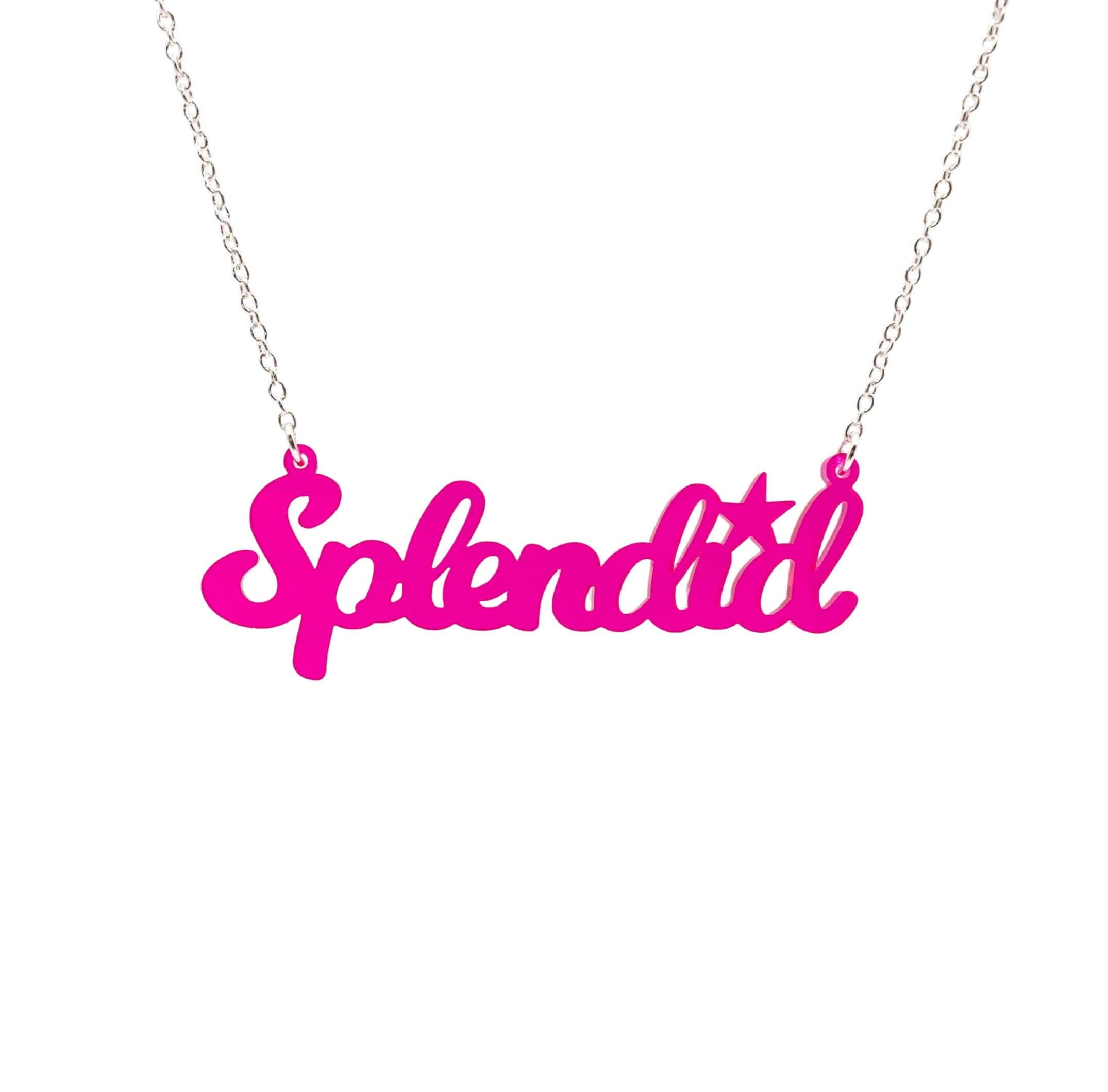 Splendid necklace in neon pink shown hanging against a white background. 