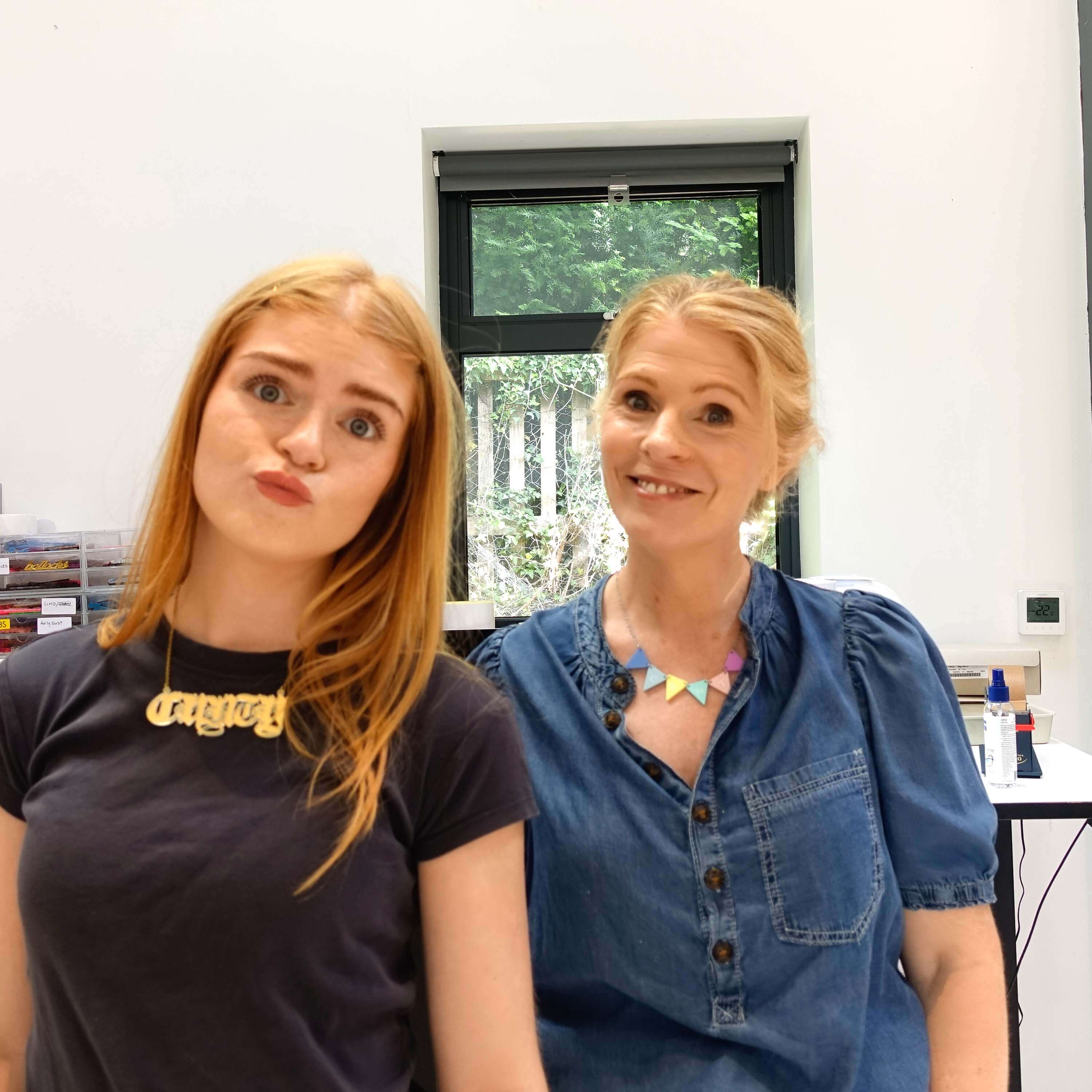 Sarah wears the C*nting Bunting necklace in pastel colours with Eliza. 