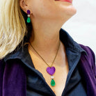 Andrea wears the Take Courage heart drop necklace with Suffragette drop earrings. 