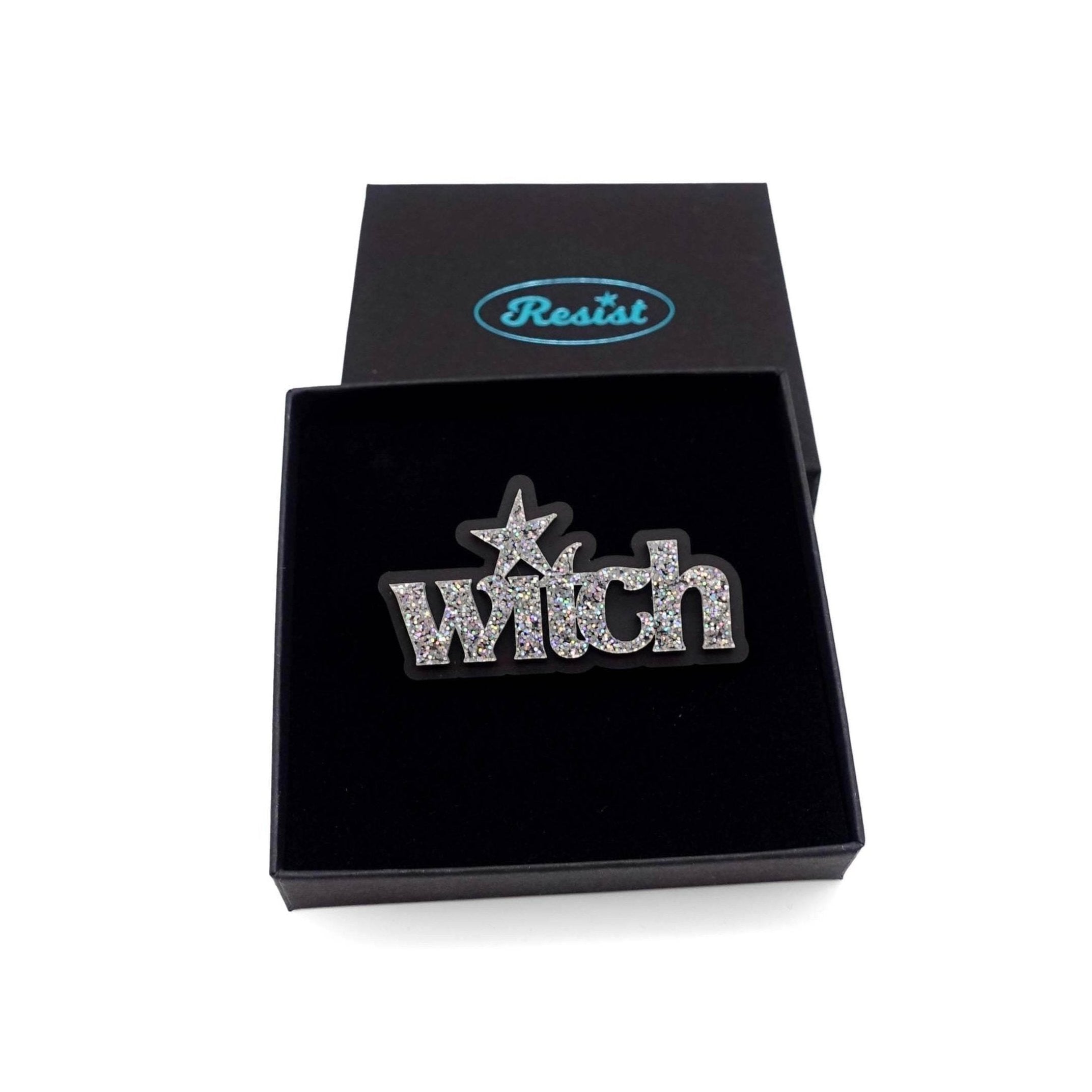 Witch brooch in silver glitter, shown in a Wear and Resist gift box. 