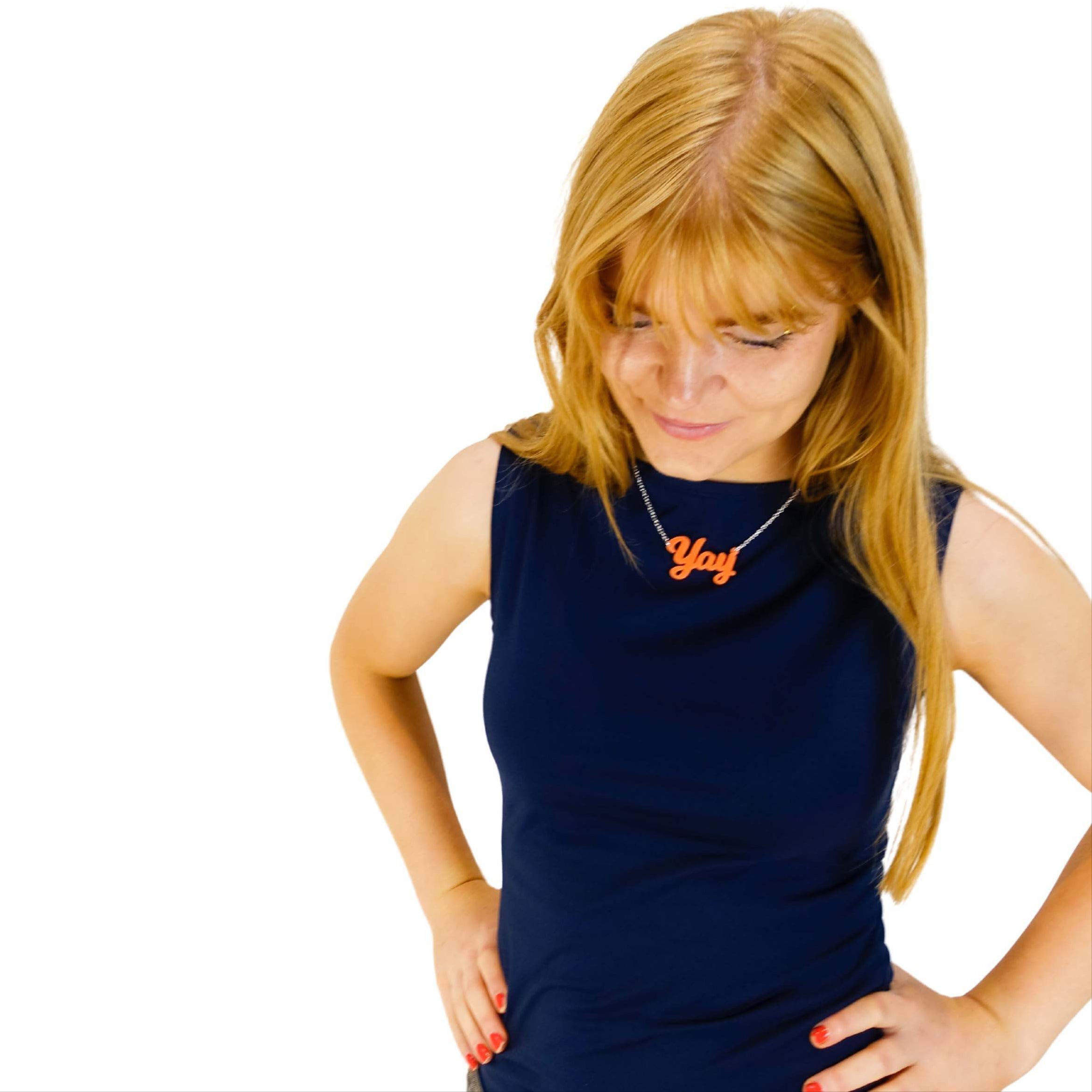 Eliza wears a Yay necklace in fluoro orange. 