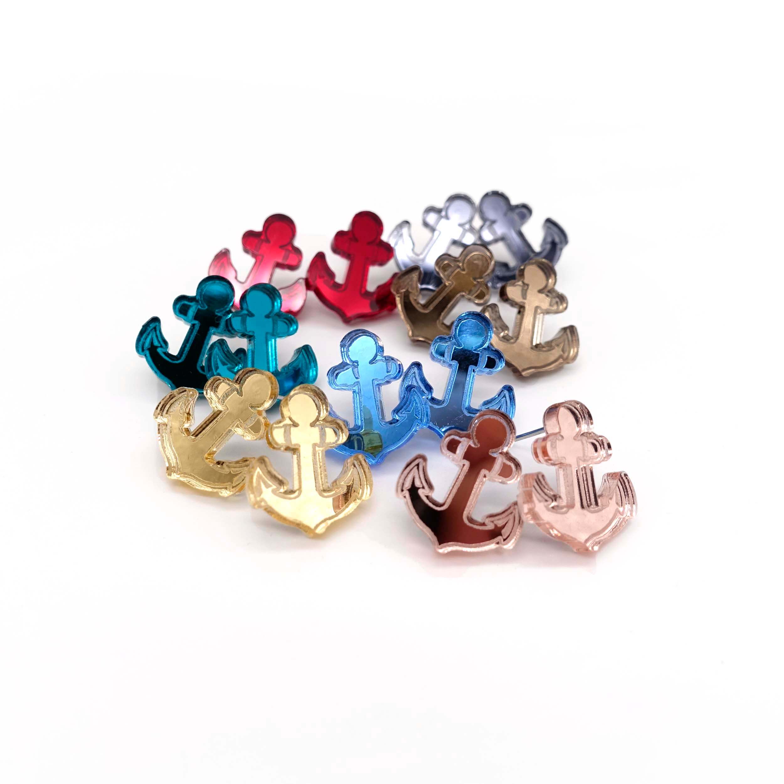 A group shot showing all seven colours of the little anchor earrings in The Courage Collection designed by Sarah Day for Wear and Resist. 