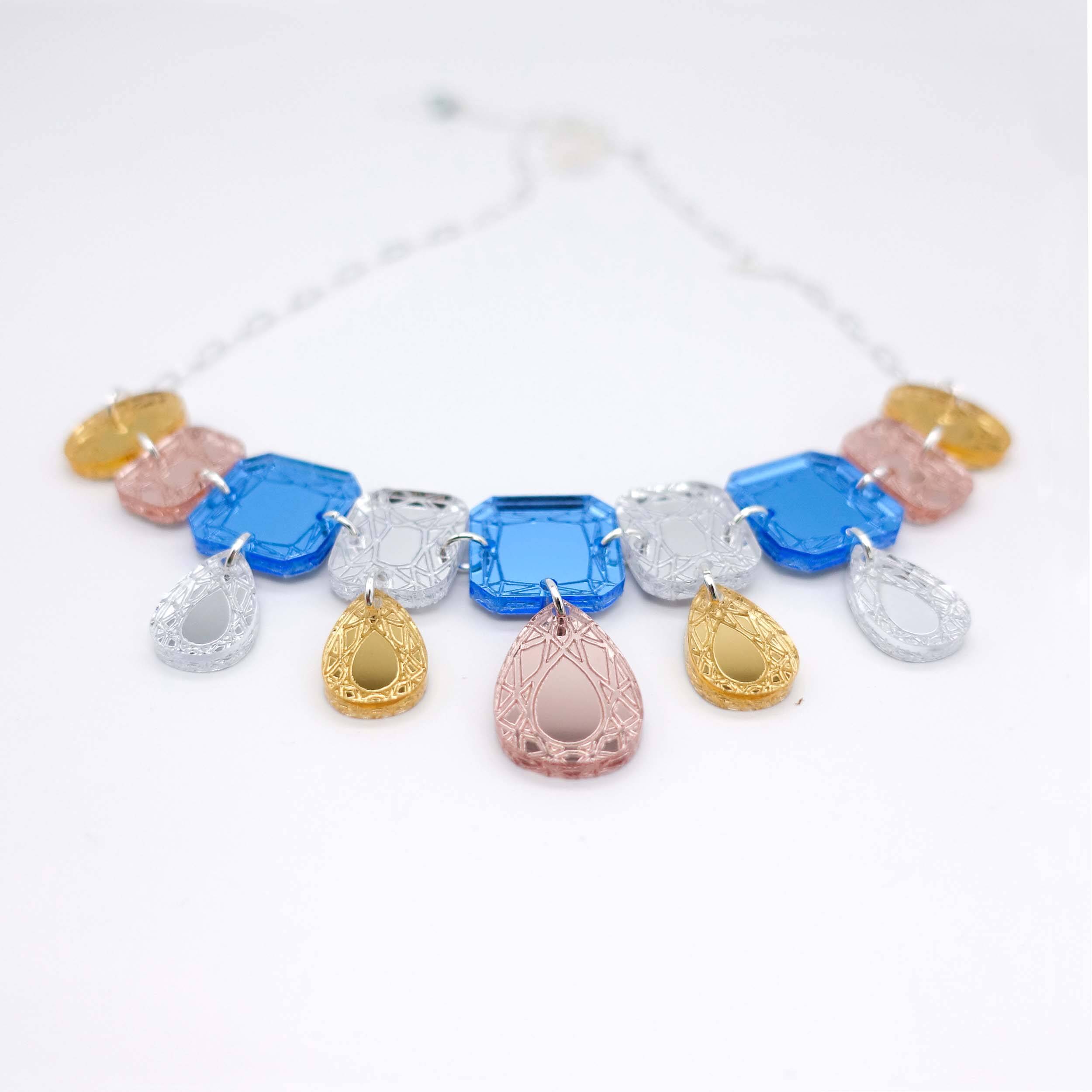 Austerity jewels necklace in soft blue colours, designed by Sarah Day for Wear and Resist. £2 goes to Women for Refugee Women. Bling for Brexit Britain! Recession chic. 
