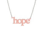 Hope necklace in blush pink shown on a silver chain hanging on a white background. 