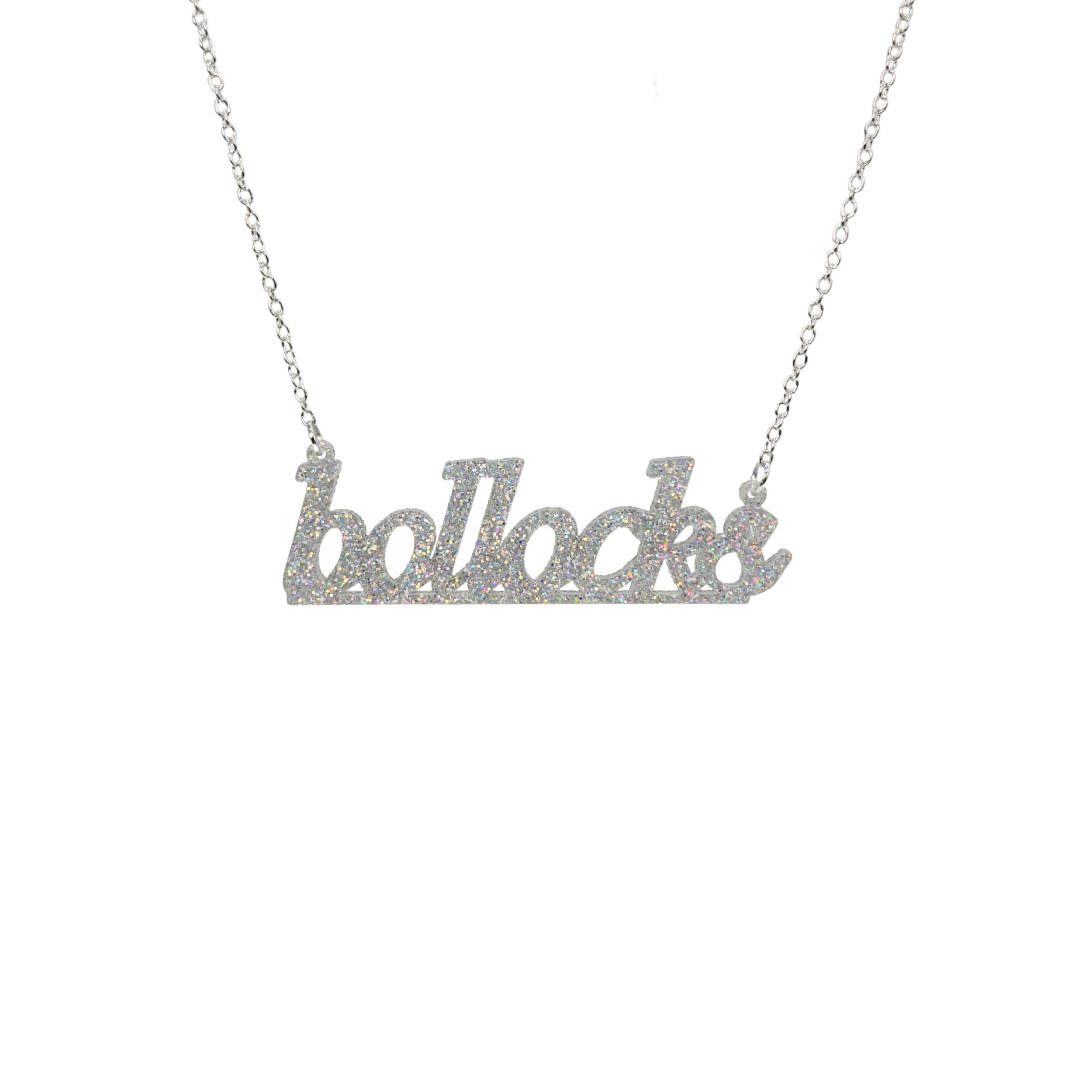 Bollocks necklace in silver glitter shown hanging against a white background. 