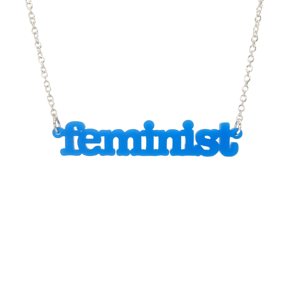 Bright blue Feminist necklace shown hanging on a white background. 