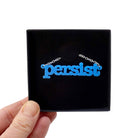 Bright blue Persist necklace shown in a Wear and Resist gift box. 