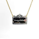 Necklace etched with rude words hanging on a gold ion-plated stainless steel chain. 