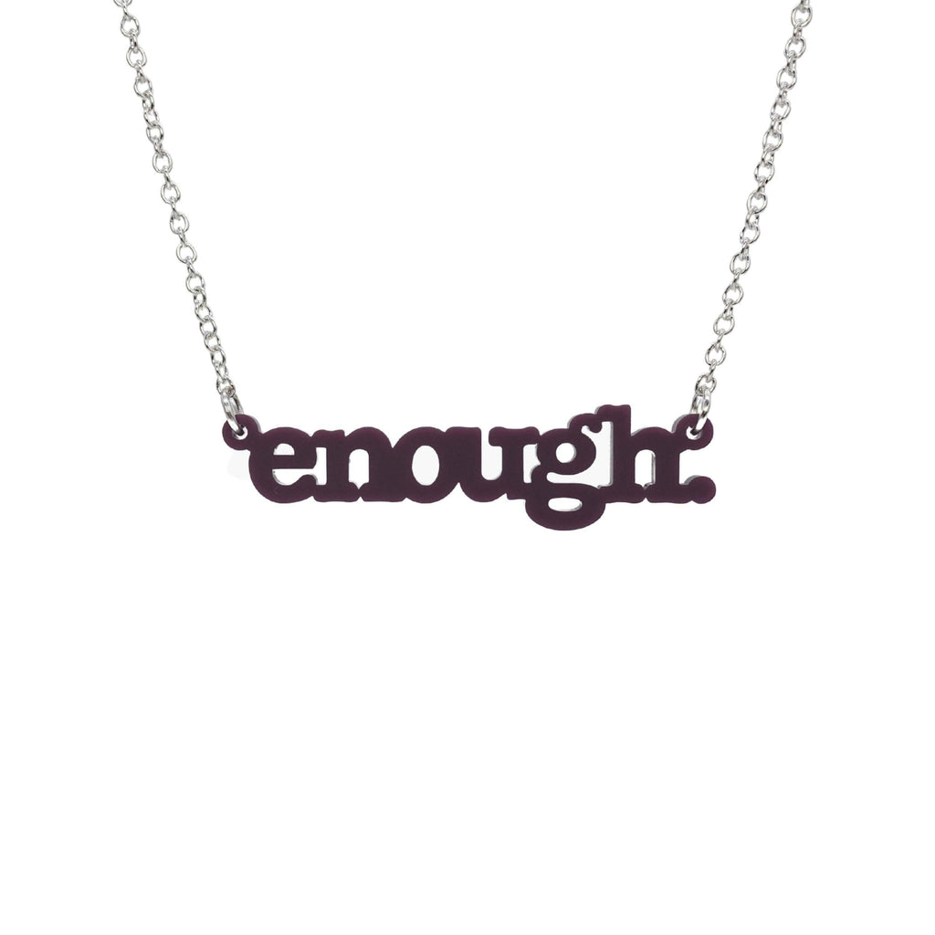 Cassis Enough necklace shown hanging on a silver chain against a white background. 