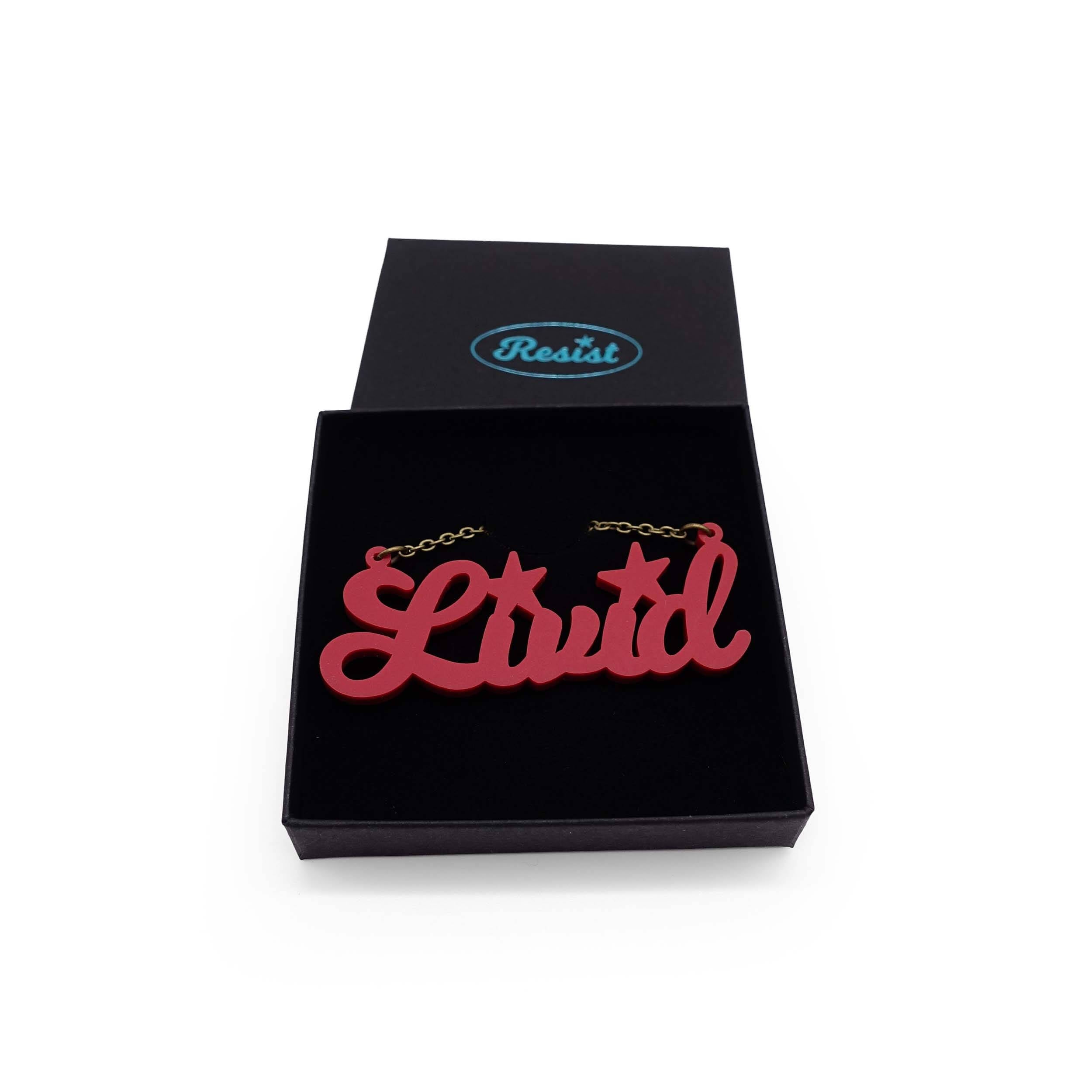 Livid necklace in cassis, shown in a Wear and Resist gift box. 