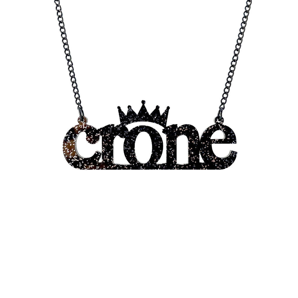 Crone necklace in black glitter , shown hanging against a white background. 