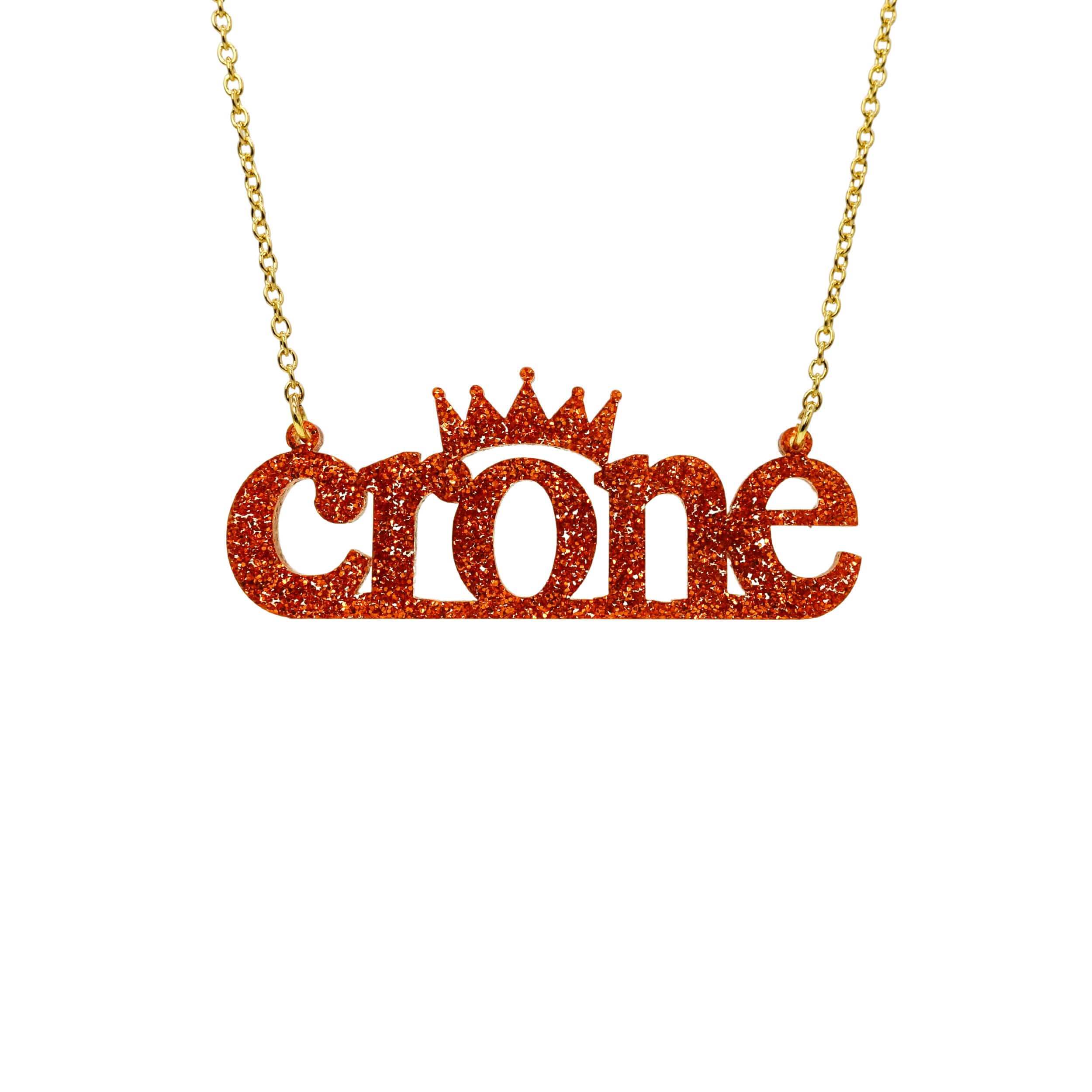 Crone necklace in flame glitter, shown hanging against a white background. 