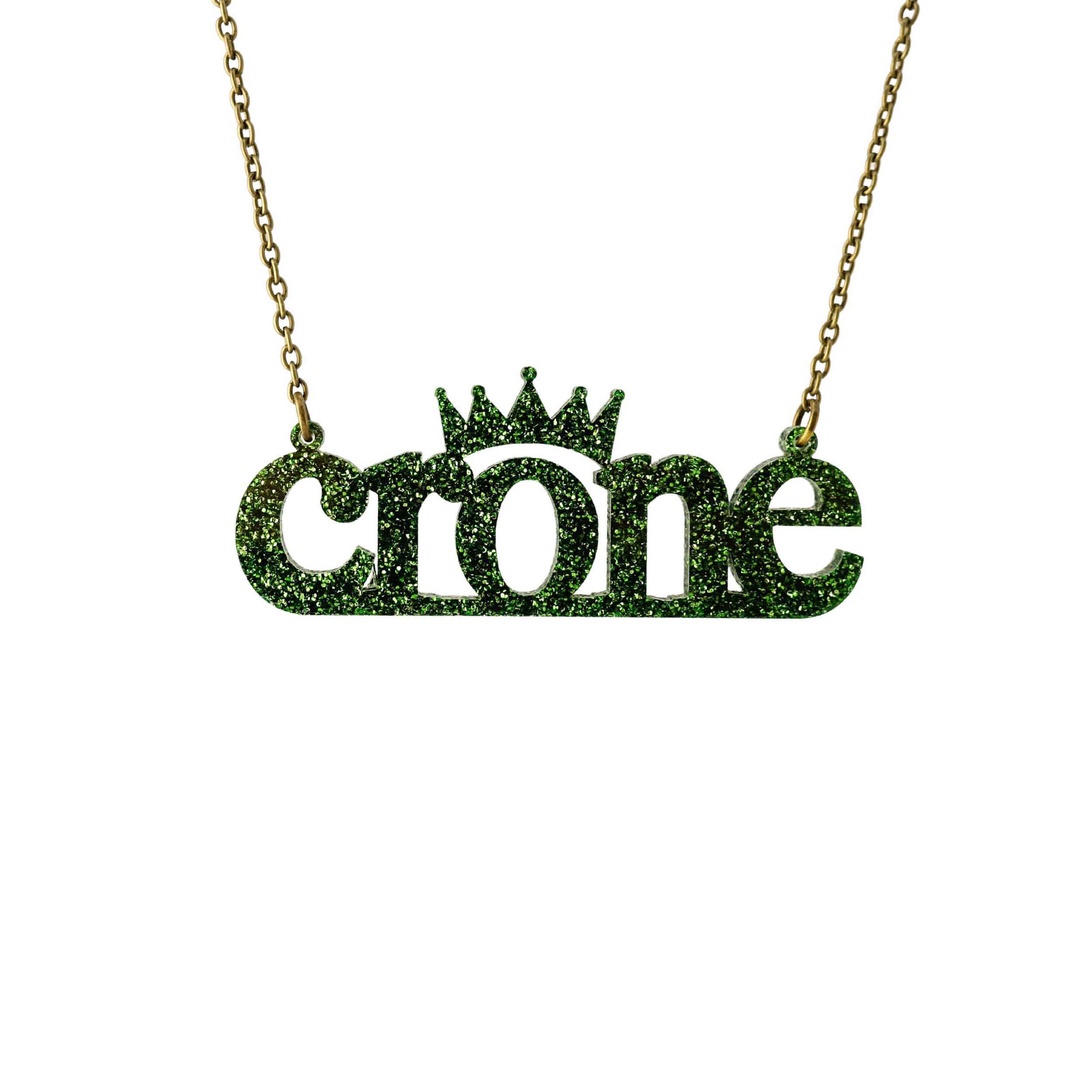 Crone necklace in moss glitter, shown hanging against a white background. 