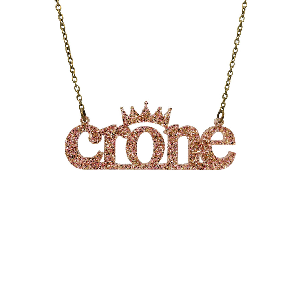 Crone necklace in pink fizz glitter, shown hanging against a white background.