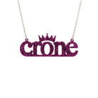Crone necklace in purple glitter, shown hanging against a white background. 