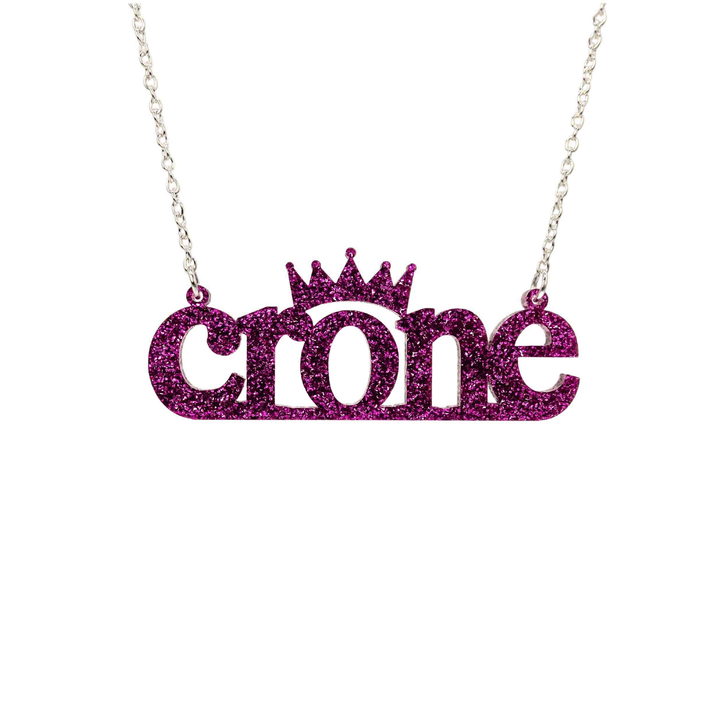 Crone necklace in purple glitter, shown hanging against a white background. 