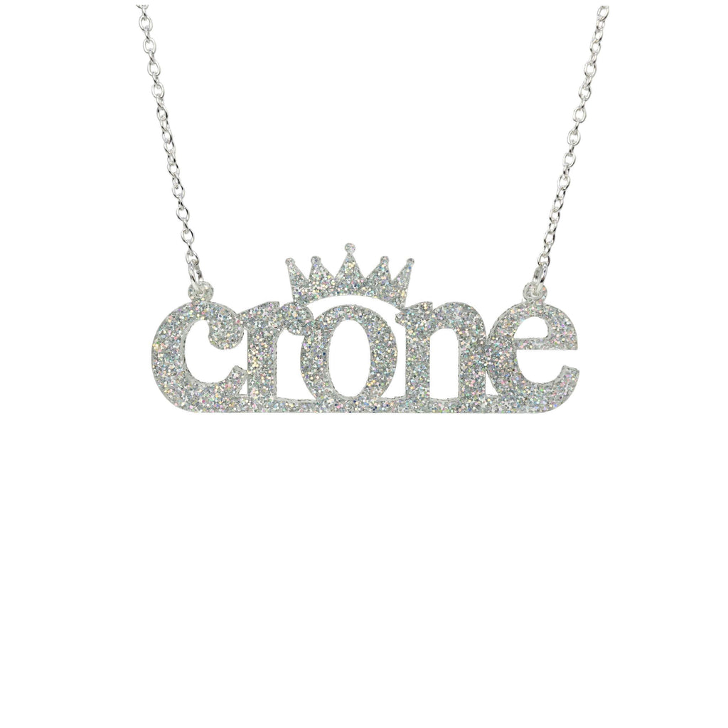 Crone necklace in silver glitter, shown hanging against a white background. 