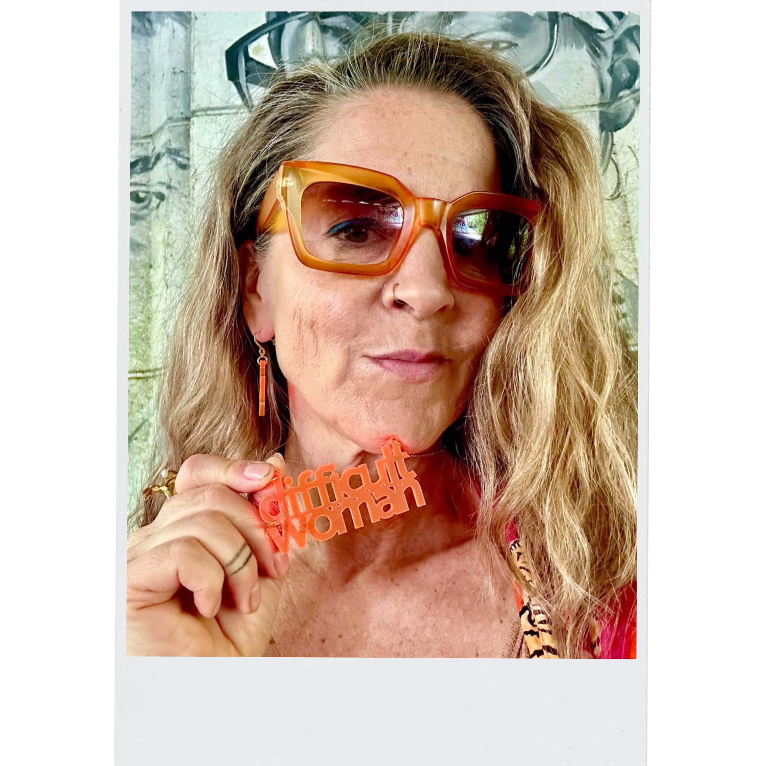 Difficult Woman necklace in summmer orange as seen out in the Persisterhood! 