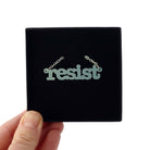 Duck egg green Resist necklace in typewriter font shown in a Wear and Resist gift box. 