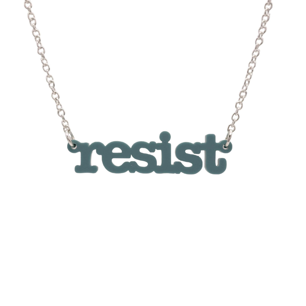 Duck egg green Resist necklace in typewriter font hanging on a silver chain against a white background. 