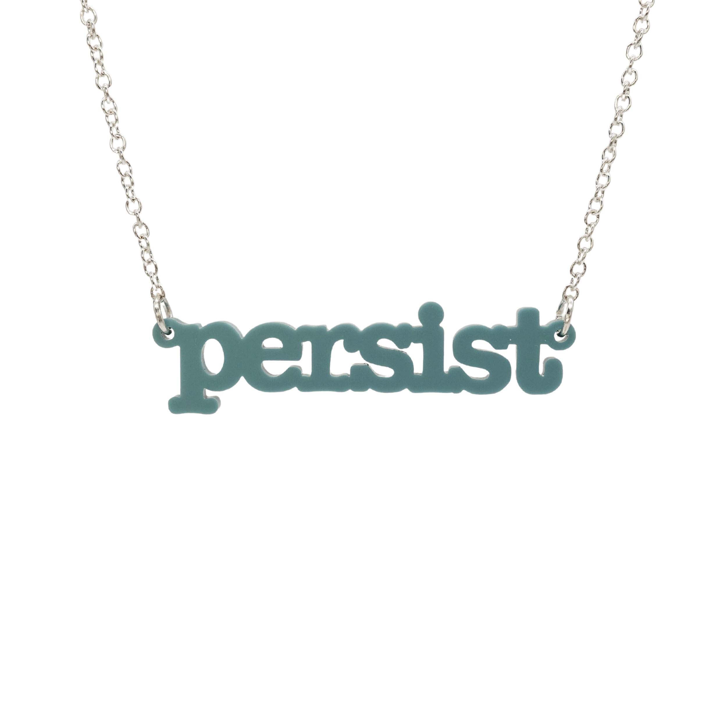 Duck egg green Persist necklace in typewriter font hanging on a silver chain against a white background. 