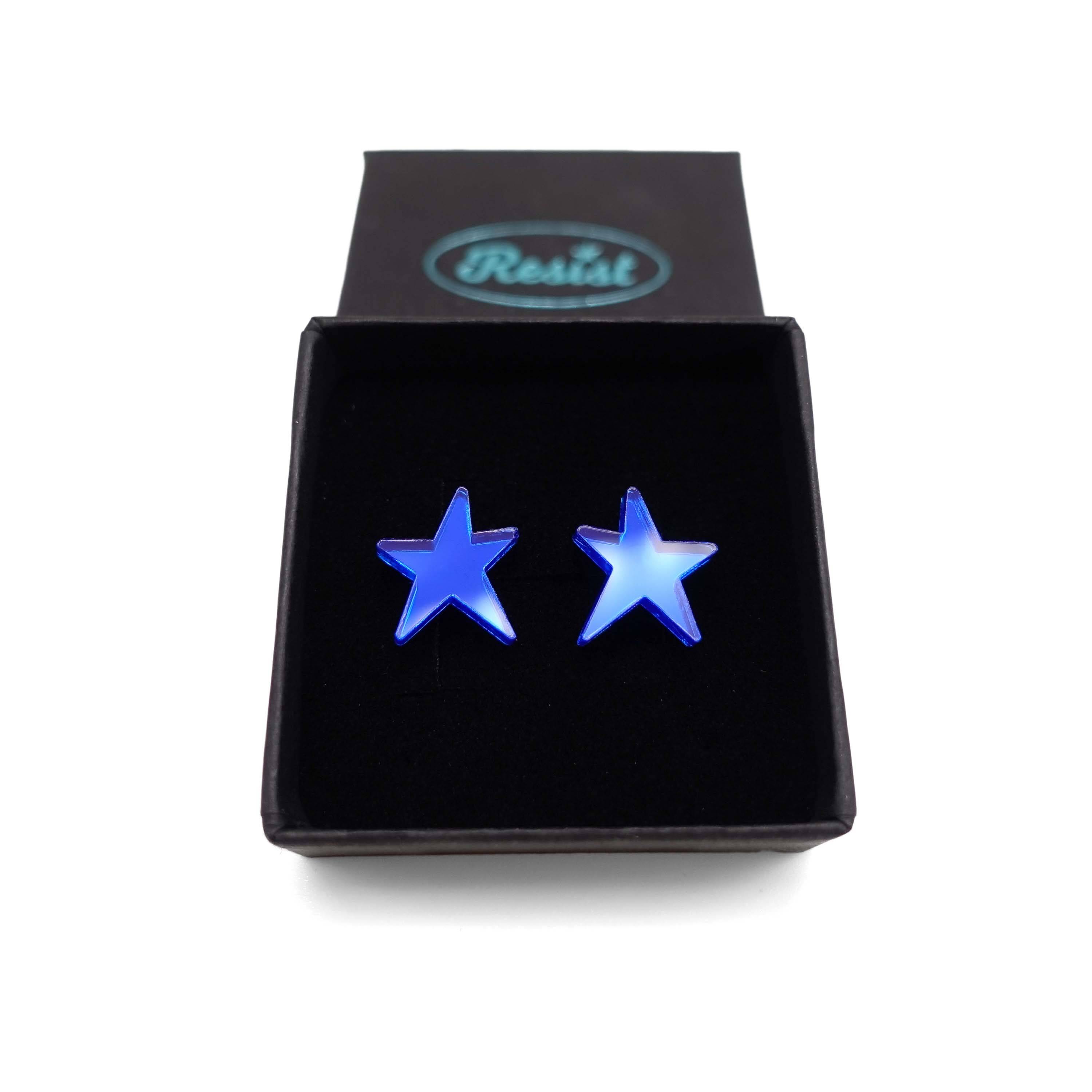 Electric blue mirror funky Resist star earrings shown in a Wear and Resist gift box. 
