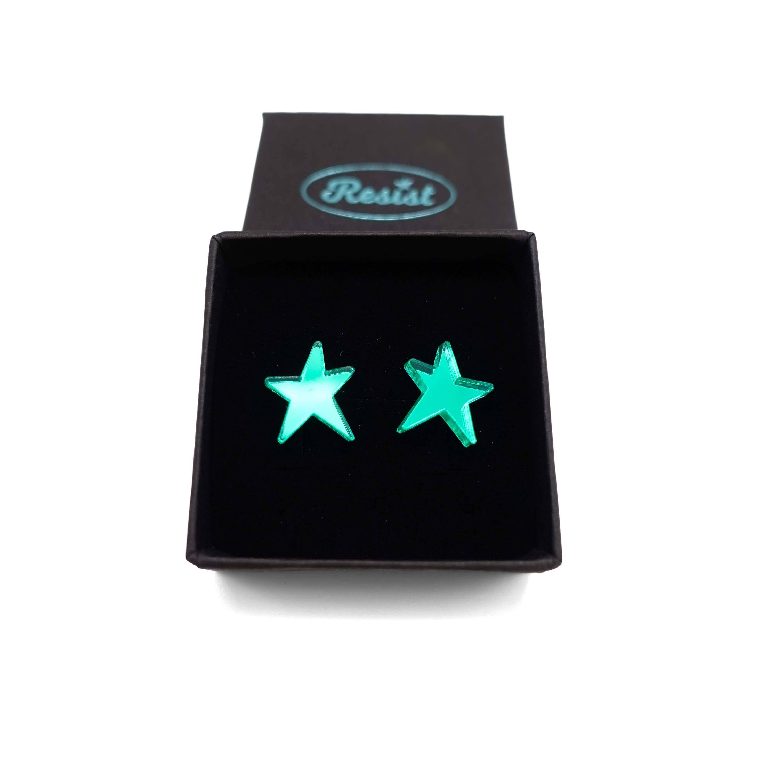 Electric green mirror funky Resist star earrings shown in a Wear and Resist gift box. 
