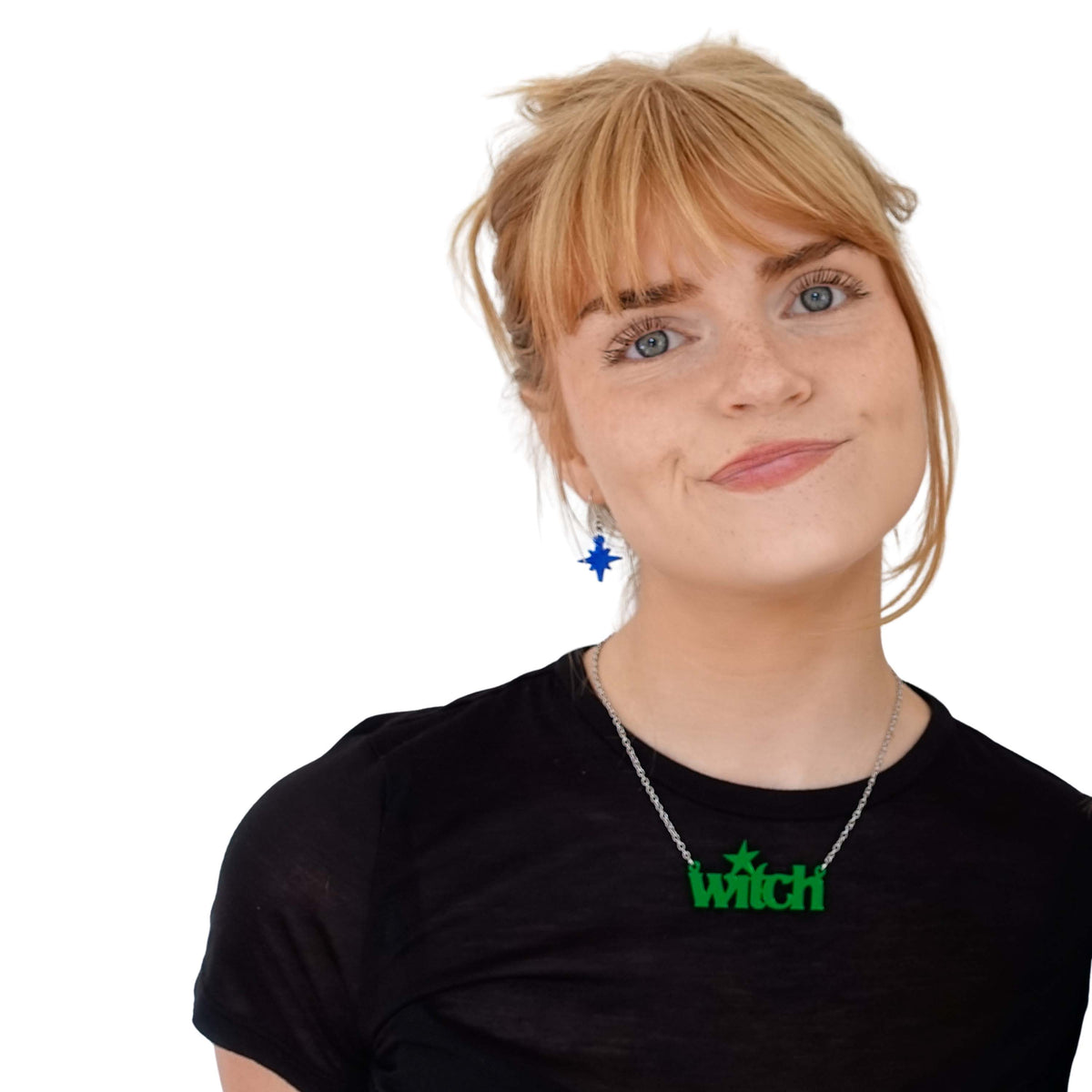 Eliza wears an envy green Witch necklace.