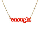 Typewriter Enough necklace in chilli frost shown hanging on a gold-plated stainless steel chain against a white background. 