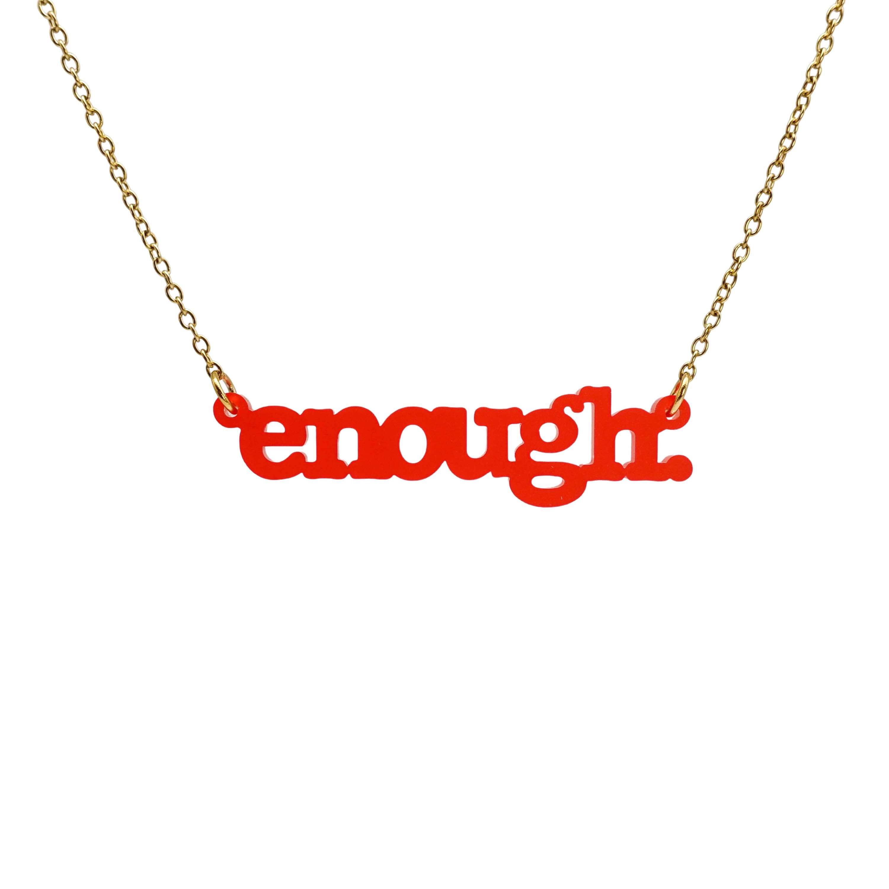 Typewriter Enough necklace in chilli frost shown hanging on a gold-plated stainless steel chain against a white background. 