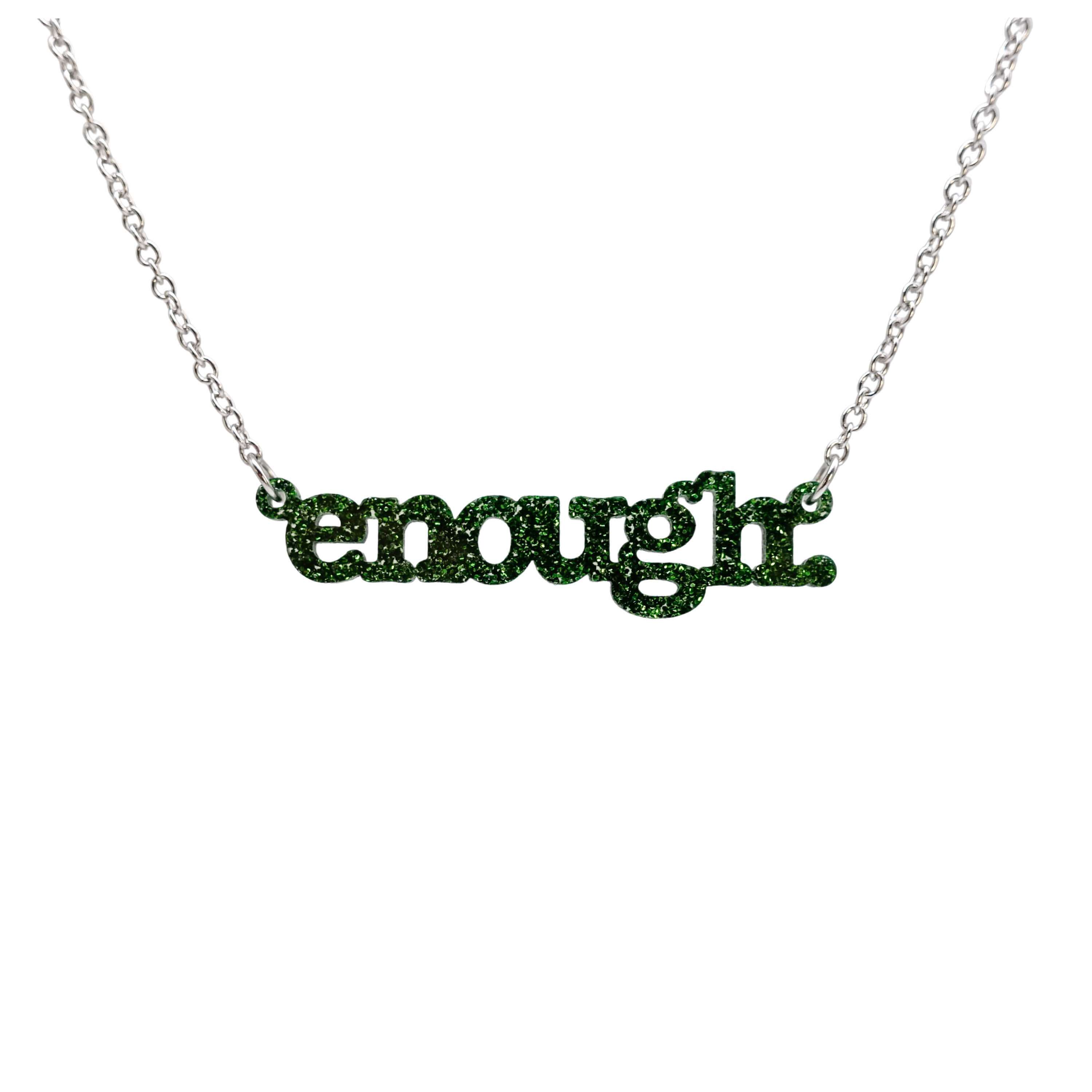 Typewriter Enough necklace in moss glitter frost shown hanging on a stainless steel chain against a white background. 