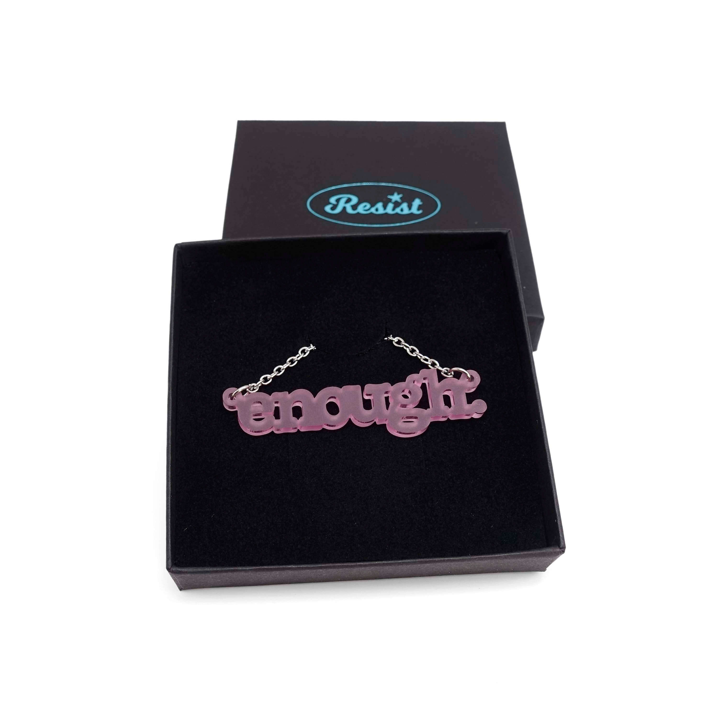 Typewriter Enough necklace in pink frost shown in a Wear and Resist gift box. 