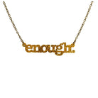 Typewriter Enough necklace in ultra gold glitter shown hanging on an antique gold chain against a white background. 