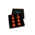 Hot red f*ck this sh*t earrings shown in a Wear and Resist gift box. 