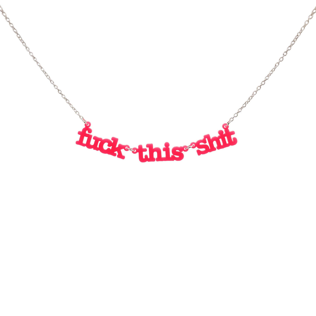 F*ck this sh*t necklace in hot pink shown hanging against a white backround. 