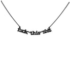 F*ck this sh*t necklace in matte black shown hanging against a white backround. 