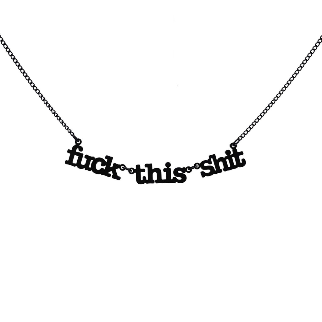 F*ck this sh*t necklace in matte black shown hanging against a white backround. 