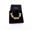 F*ck this Sh*t necklace in matte iridescent shown in a Wear and Resist gift box.