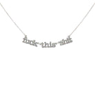 F*ck this sh*t necklace in silver glitter shown hanging against a white backround. 