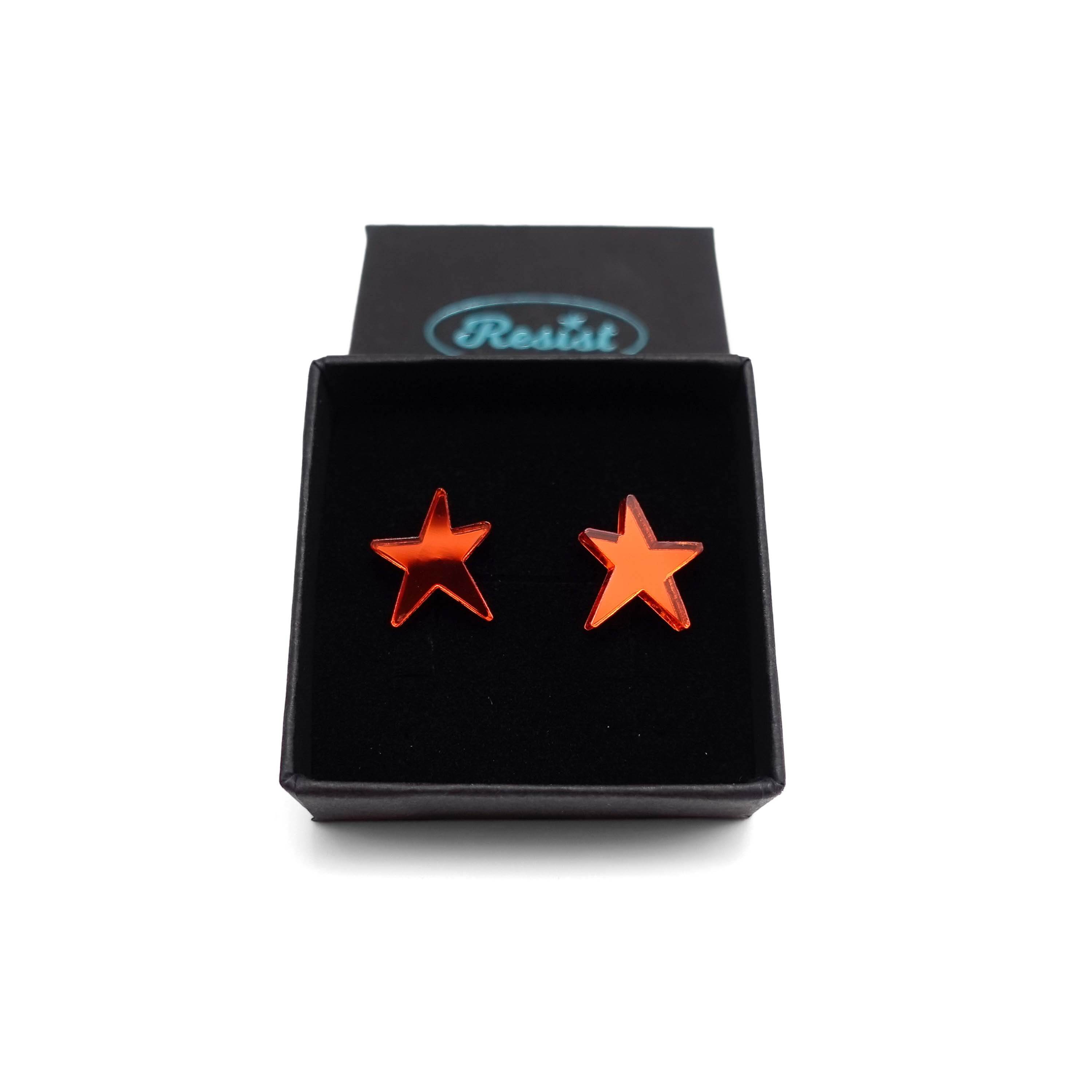Flame mirror funky Resist star earrings shown in a Wear and Resist gift box. 
