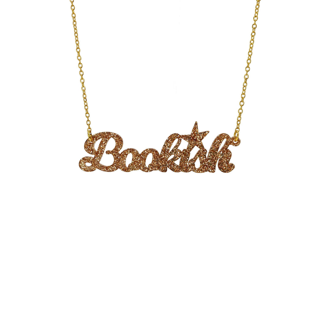 Gold Bookish necklace shown against a white background. 