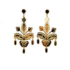 All gold festive drop earrings shown hanging in front of white background. 