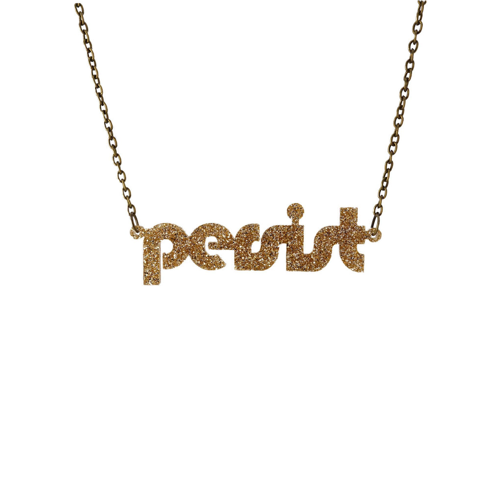 Gold glitter disco persist necklace shown hanging against a white background. 