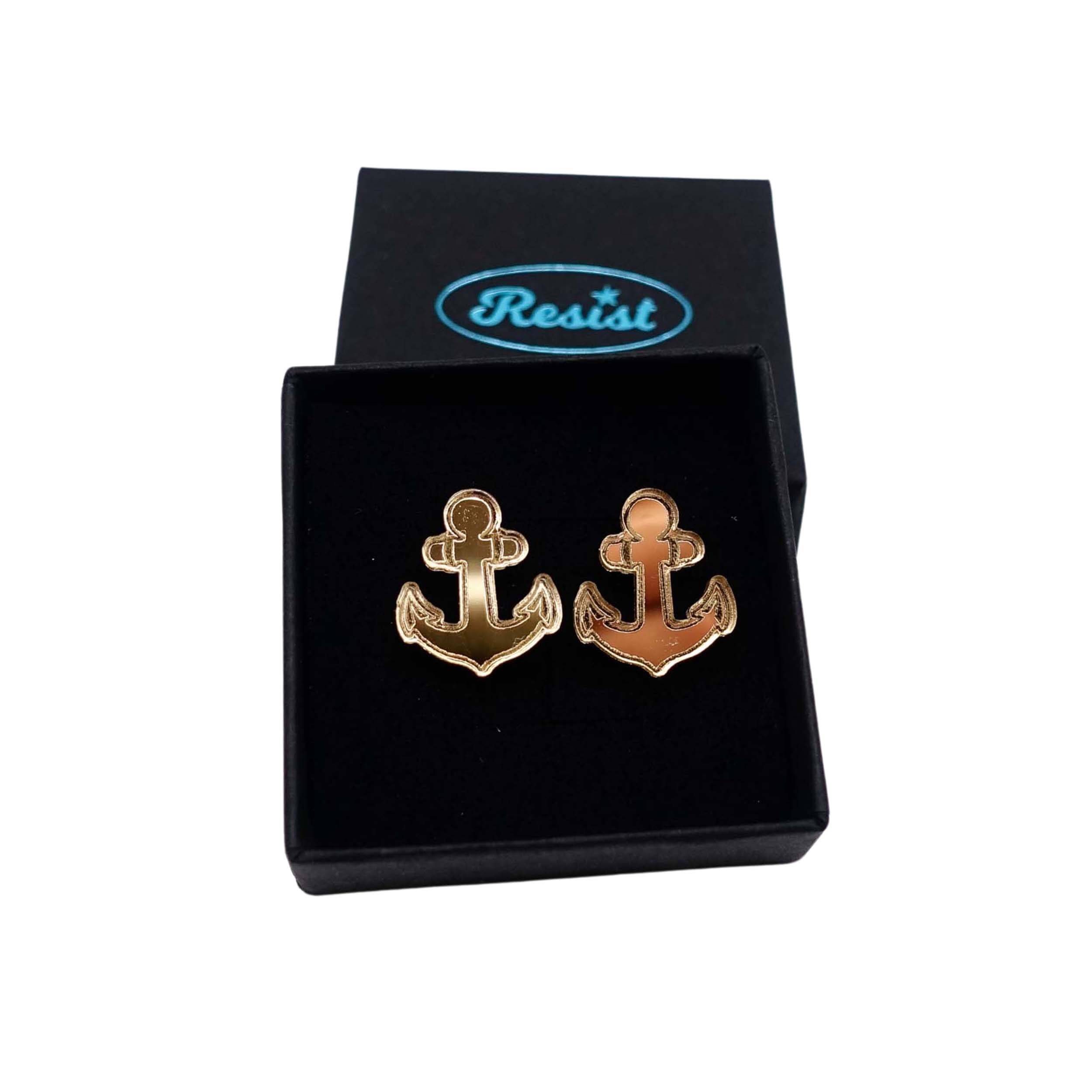 Gold mirror little anchor earrings shown in a Wear and Resist gift box. 